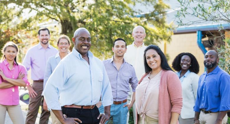 Group of people outside smiling at the camera