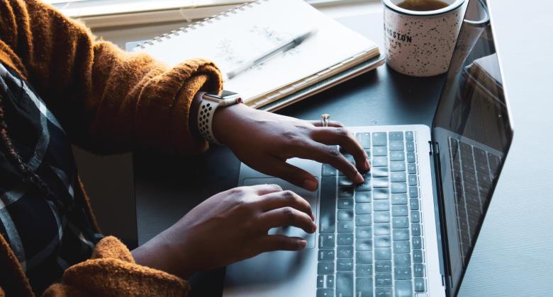 Woman typing on laptop